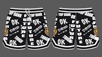 a pair of black and white basketball shorts with words on them